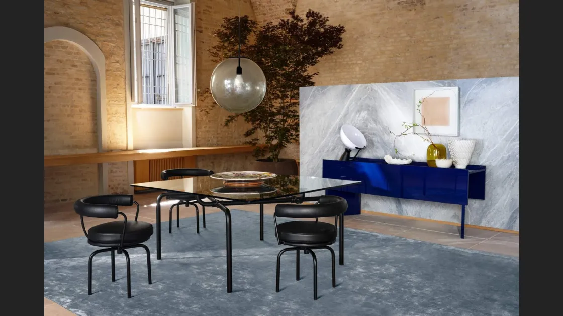 Sedia girevole Durable in pelle imbottita con struttura in tubolare di acciaio di Cassina